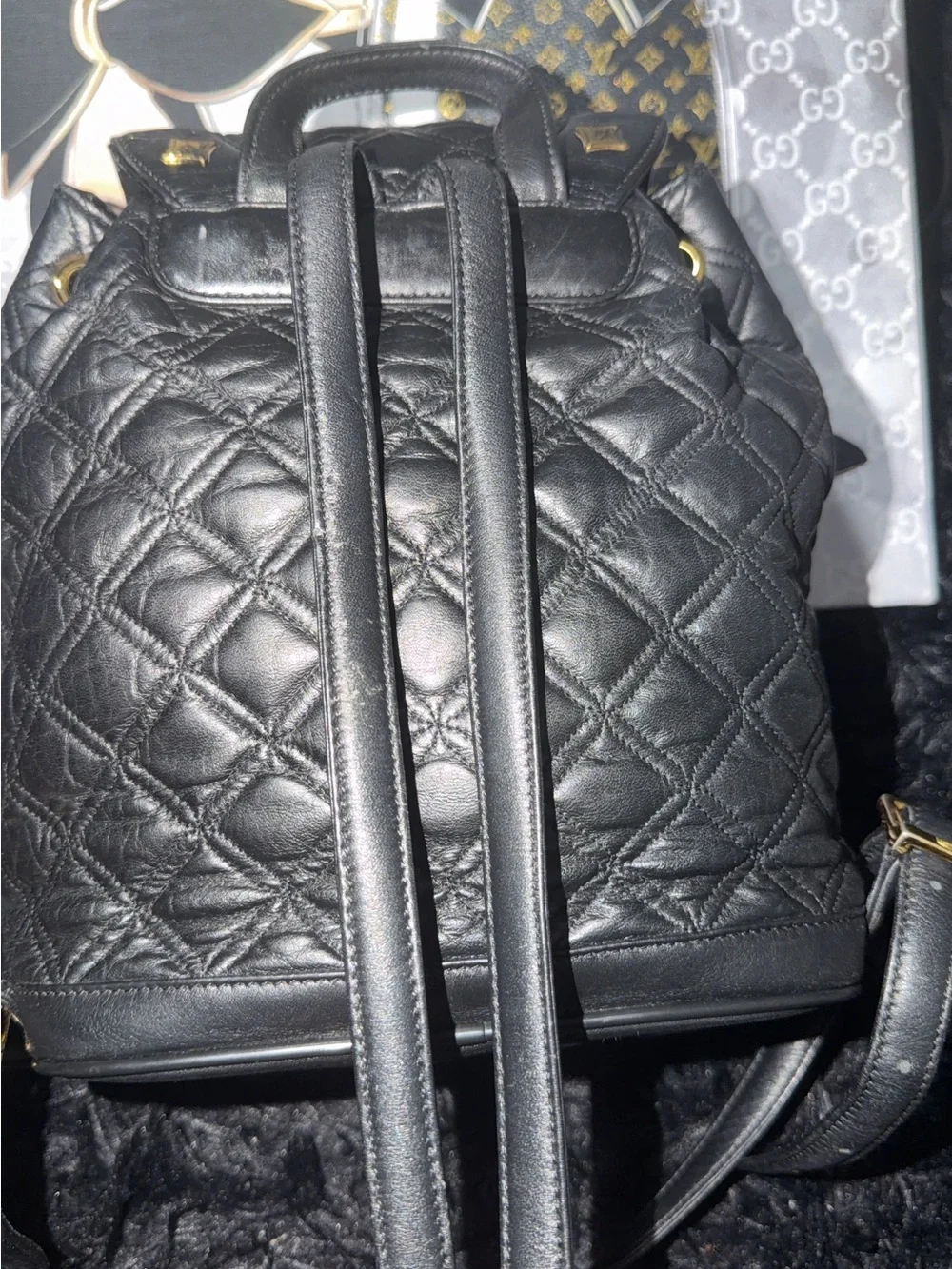 MCM Black Quilted Leather Backpack with Gold Hardware Accents